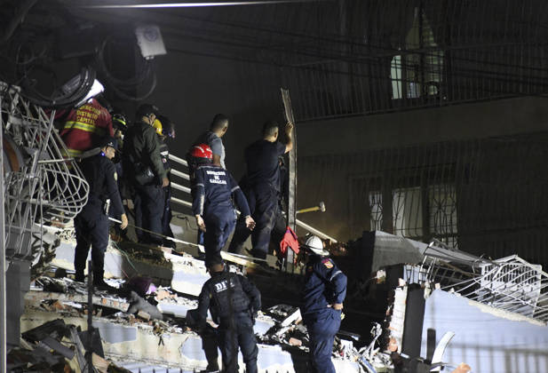 (260625) -- CARACAS, June 25, 2026 -- Rescuers work at the ruins of a building in Caracas, Venezuela, June 24, 2026. At least 32 people were killed and more than 700 injured after two powerful earthquakes jolted Venezuela late Wednesday, the country s acting President Delcy Rodriguez said in an official update early Thursday. (Photo by Xinhua) (SpotNews) VENEZUELA-EARTHQUAKE-AFTERMATH MarcosxSalgado
