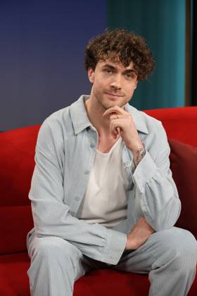 Timon Krause, mentalist, author, mind reader, and hypnotist, appeared as a guest on the television show *DAS Rote Sofa*, a live talk show produced by Norddeutscher Rundfunk (NDR); photo op on June 26, 2026, at the NDR television studio in Hamburg-Lokstedt
