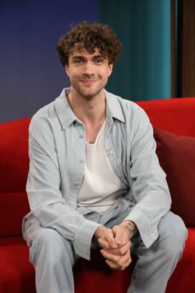 Timon Krause, mentalist, author, mind reader, and hypnotist, appeared as a guest on the television show *DAS Rote Sofa*, a live talk show produced by Norddeutscher Rundfunk (NDR); photo op on June 26, 2026, at the NDR television studio in Hamburg-Lokstedt