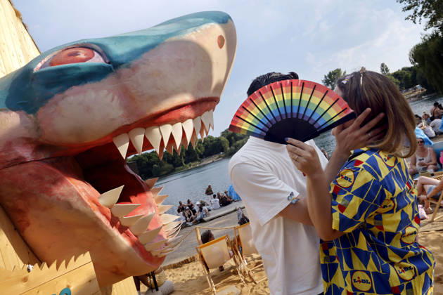 Visitors behind a rainbow fan next to a shark in the Sharkroom at the Rainbow Festival 2026 at Fühlinger See. Markus Krampe’s Rainbow Festival takes place as part of ColognePride. Cologne, June 27, 2026, North Rhine-Westphalia, Germany Copyright: xChristophxHardtx