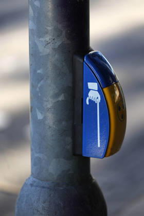 Düsseldorf, Germany, September 6, 2023 Traffic signal systems for blind and visually impaired people—known as traffic lights for the blind —are equipped with special additional features which ensure safe crossing of the street. They feature audible and tactile signals on the yellow traffic signal boxes at a crosswalk in Düsseldorf-Mörsenbroich.