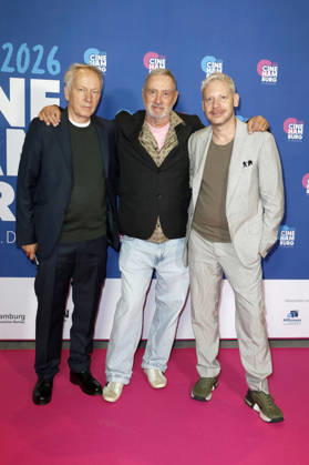 Thomas Wöbke, Roland Emmerich, and Marco Kreuzpaintner at the presentation of the Gläsernes Leinwand award to Roland Emmerich as part of CineHamburg 2026 at Cinemaxx Dammtor in Hamburg, July 7, 2026 Foto:xC.xTamckex xFuturexImagex emmerich_6729