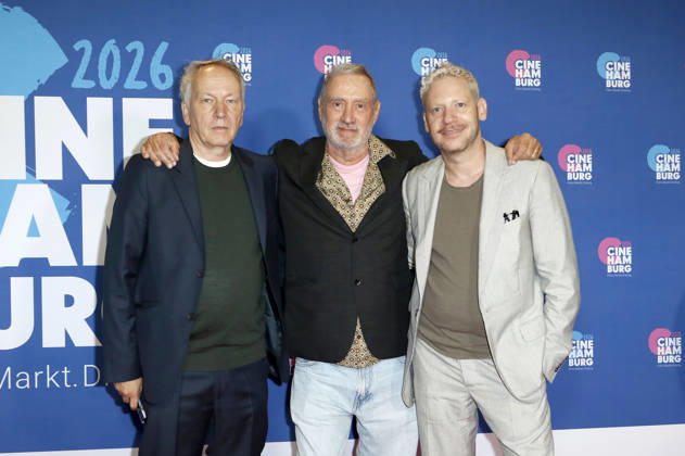 Thomas Wöbke, Roland Emmerich, and Marco Kreuzpaintner at the presentation of the Gläsernes Leinwand award to Roland Emmerich as part of CineHamburg 2026 at Cinemaxx Dammtor in Hamburg, July 7, 2026 Foto:xC.xTamckex xFuturexImagex emmerich_6731