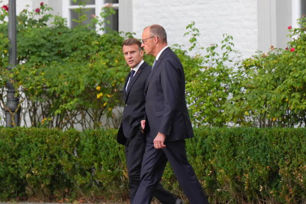 Visit by the French President to Federal Chancellor Merz in Bensberg Federal Chancellor Friedrich Merz walks with French President Emmanuel Macron through the hotel’s entrance area prior to the delegation meeting in the Salon Medici at the Schlosshotel Bensberg, Bensberg, July 16, 2026, Bensberg, North Rhine-Westphalia, Germany