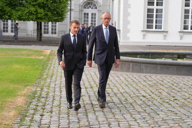 Visit by the French President to Federal Chancellor Merz in Bensberg Federal Chancellor Friedrich Merz walks with French President Emmanuel Macron through the hotel’s entrance area prior to the delegation meeting in the Salon Medici at the Schlosshotel Bensberg, Bensberg, July 16, 2026, Bensberg, North Rhine-Westphalia, Germany