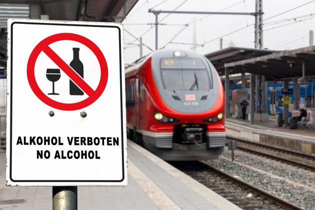 Germany - July 22, 2026: PHOTO MONTAGE, DB train with a sign reading: KEIN ALKOHOL, NO ALCOHOL! Deutsche Bahn (DB) is gradually introducing a nationwide ban on alcohol consumption at its train stations. The ban applies to platforms and station concourses, but not to restaurants and bars