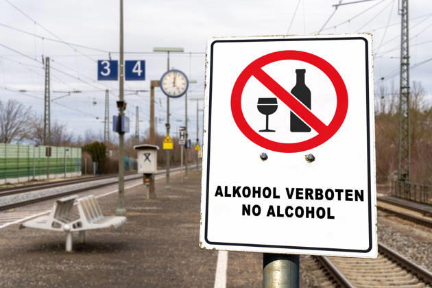 Germany - July 22, 2026: PHOTOMONTAGE, sign at the train station: ALCOHOL PROHIBITED, NO ALCOHOL. Deutsche Bahn (DB) is gradually implementing a nationwide ban on alcohol consumption at its train stations. The ban applies to platforms and station concourses, but not to food and beverage establishments
