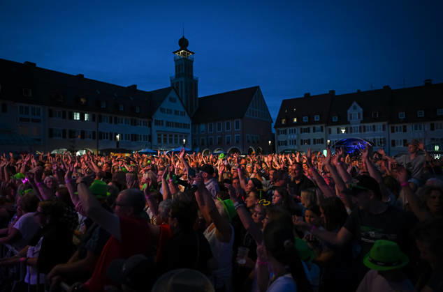 Freudenstadt, July 24, 2026: Black Forest Air Open Air Festival on the Market Square—overview, spectators, and fans create a lively atmosphere on the Market Square with the town hall tower in the background; headliner: DJ Oetzi with his band