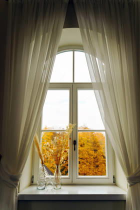 Sheer curtains frame an arched window autumn view Burbi?kis, Utena County, Lithuania CR_EDSAHG260728B-2089476-01 ,model released, Symbolfoto ,property released