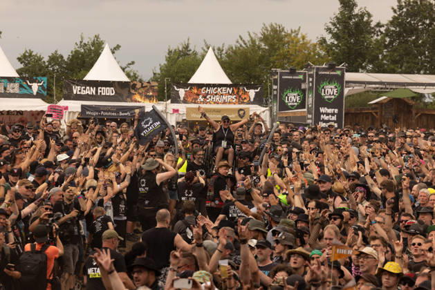 The 35th Wacken Open Air: Friday, Headliner Day, and Friday is Flyday, when people with disabilities—including those in wheelchairs—crowd-surfed. With temperatures that were almost mild, Friday at the Wacken Open Air once again broke all records. All day long, fans waited not only for Judas