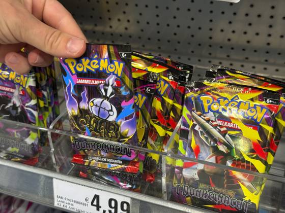 August 5, 2026, Germany, Bavaria, Pokémon trading cards on a shelf at a supermarket in Bavaria; a young teenage girl reaches for a pack August 5, 2026, Pokémon August 5, 2026, Pokémon