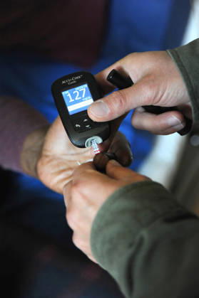 Blood sample taken with a glucose meter from a patient. Home-visiting private nurse. Diabetes Bsip_016985_170