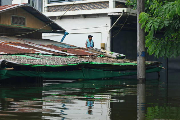 August 20, 2026, Ngathaingchaung, Ayeyarwady Region, Myanmar: A resident remains inside a flooded house in Ngathaingchaung Township, Ayeyarwady Region, Myanmar..In Laymyethna Township, Ayeyarwady Region, the Ngawun River embankment collapsed on July 31, leaving nearby towns including Hinthada, Yegyi, Ngathaingchaung, Kyonpyaw and Kyaunggon still inundated for three weeks, affecting tens of thousands of people, officials said. Ngathaingchaung Myanmar  - ZUMAn324 20260820_zip_n324_008 Copyright: xAyexMyaxNaingx