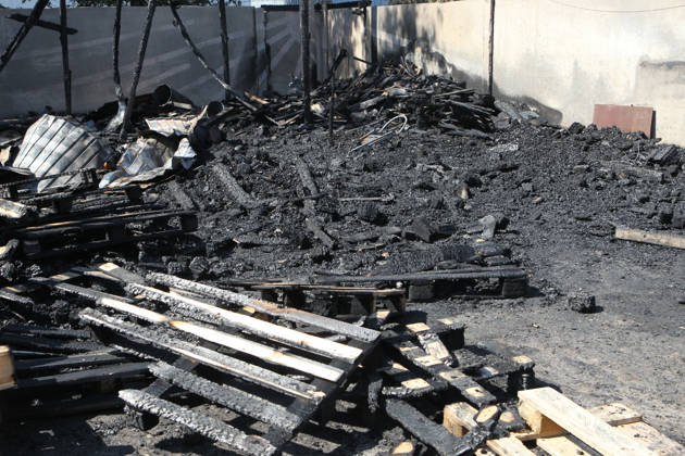 Burnt wooden pallets that caught fire as a result of a nighttime Russian UAV attack are in a parking lot near a shopping and entertainment centre in Dnipro, Ukraine, August 25, 2026. Fires broke out inside and near the shopping mall as a result of the Russian attack. (Photo by Mykola Miakshykov Ukrinform) Russian attack hits parking lot near shopping mall in Dnipro suburb  Copyright: xMykolaxMiakshykovx