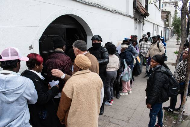 August 25, 2026, Santiago, Chile: SANTIAGO, CHILE, AUGUST 25, 2026: Haitian citizens gather at the Consulate of Haiti in Santiago to complete paperwork related to the regularization of their immigration status in Chile. Santiago Chile  - ZUMAq101 20260825_zna_q101_147 Copyright: xVicentexAsenciox
