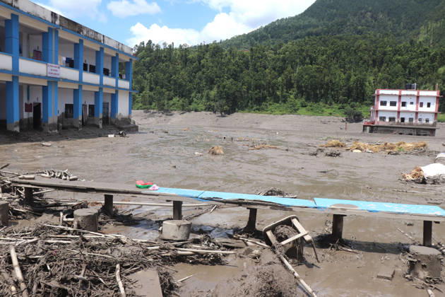 (260826) -- KATHMANDU, Aug. 26, 2026 -- This photo taken on Aug. 26, 2026 shows damaged buildings after flash floods in Nuwakot District, Nepal. As many as 72 people have been found dead in the flash flood in the Bhote Koshi River in Nepal, police said. Abi Narayan Kafle, spokesperson of Nepal Police, confirmed to Xinhua, adding that 41 injured people have been receiving treatment in different hospitals. (RSS via Xinhua) (SpotNews) NEPAL-FLASH FLOODS-AFTERMATH ZhangxPing 