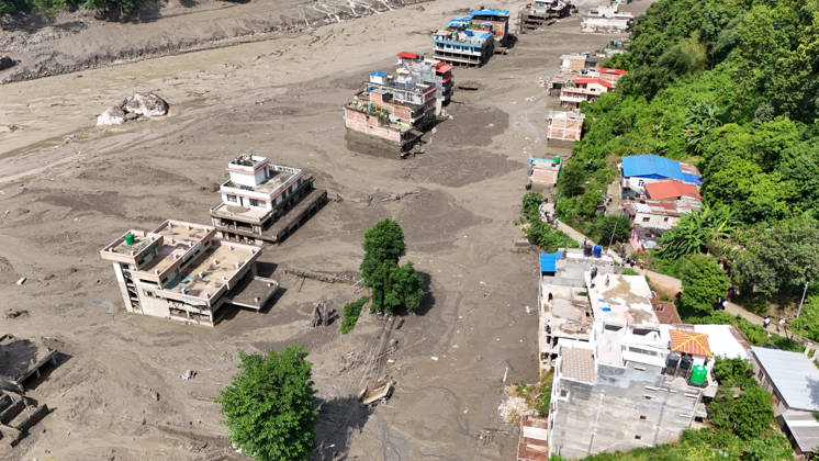 August 26, 2026, Nuwakot, Nepal: An aerial view shows buildings and infrastructure damaged along the swollen Trishuli River following a massive flash flood triggered by an avalanche of ice and rock in the upper Lhende River on the Tibetan side, in Nuwakot district, Nepal, on Wednesday, August 26, 2026. The sudden flood swept through communities along the Bhote Koshi and Trishuli river systems, destroying homes, roads and bridges and leaving widespread devastation downstream. Nuwakot Nepal  - ZUMAg200 20260826_zap_g200_007 Copyright: xSkandaxGautamx