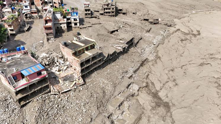 August 26, 2026, Nuwakot, Nepal: An aerial view shows buildings and infrastructure damaged along the swollen Trishuli River following a massive flash flood triggered by an avalanche of ice and rock in the upper Lhende River on the Tibetan side, in Nuwakot district, Nepal, on Wednesday, August 26, 2026. The sudden flood swept through communities along the Bhote Koshi and Trishuli river systems, destroying homes, roads and bridges and leaving widespread devastation downstream. Nuwakot Nepal  - ZUMAg200 20260826_zap_g200_010 Copyright: xSkandaxGautamx