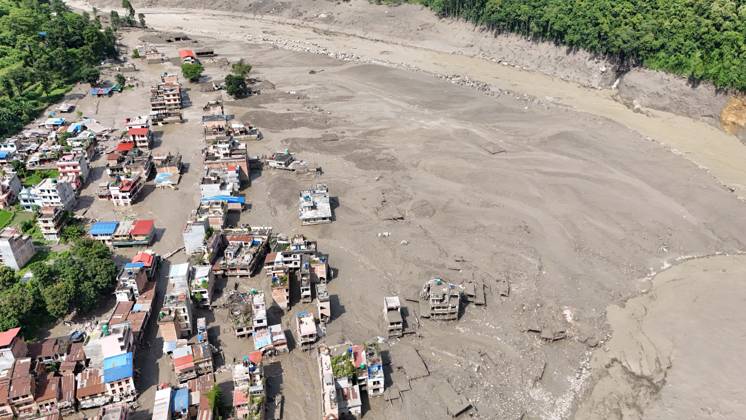 August 26, 2026, Nuwakot, Nepal: An aerial view shows buildings and infrastructure damaged along the swollen Trishuli River following a massive flash flood triggered by an avalanche of ice and rock in the upper Lhende River on the Tibetan side, in Nuwakot district, Nepal, on Wednesday, August 26, 2026. The sudden flood swept through communities along the Bhote Koshi and Trishuli river systems, destroying homes, roads and bridges and leaving widespread devastation downstream. Nuwakot Nepal - ZUMAg200 20260826_zap_g200_012 Copyright: xSkandaxGautamx