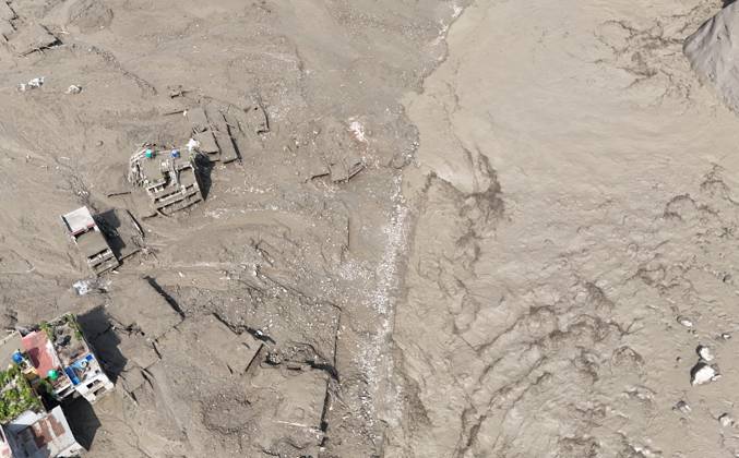 August 26, 2026, Nuwakot, Nepal: An aerial view shows buildings and infrastructure damaged along the swollen Trishuli River following a massive flash flood triggered by an avalanche of ice and rock in the upper Lhende River on the Tibetan side, in Nuwakot district, Nepal, on Wednesday, August 26, 2026. The sudden flood swept through communities along the Bhote Koshi and Trishuli river systems, destroying homes, roads and bridges and leaving widespread devastation downstream. Nuwakot Nepal  - ZUMAg200 20260826_zap_g200_022 Copyright: xSkandaxGautamx