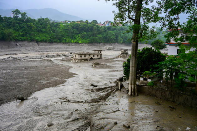 August 26, 2026, Kathmandu, Bagmati, Nepal: NUWAKOT, NEPAL - AUGUST 26: An aftermath view of flash floods and mudslides along the Trishuli River in Nuwakot, Nepal, on August 26, 2026. A catastrophic flash flood swept through Nepalâ€⠢s northern border region after an ice-and-rock avalanche, reportedly triggered by an earthquake, caused a sudden surge in the Lhende River on the Nepal-China border and sent massive volumes of water, mud and debris downstream into the Bhote Koshi and Trishuli river systems. The disaster devastated settlements in Rasuwa and Nuwakot districts, sweeping away homes, roads, bridges, vehicles and other infrastructure and severely damaging hydropower and power facilities. In Nuwakot, riverside settlements includin - ZUMAs330 20260826_zsp_s330_008 Copyright: xSafalxPrakashxShresthax