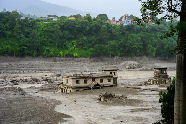 August 26, 2026, Kathmandu, Bagmati, Nepal: NUWAKOT, NEPAL - AUGUST 26: An aftermath view of flash floods and mudslides along the Trishuli River in Nuwakot, Nepal, on August 26, 2026. A catastrophic flash flood swept through Nepalâ€⠢s northern border region after an ice-and-rock avalanche, reportedly triggered by an earthquake, caused a sudden surge in the Lhende River on the Nepal-China border and sent massive volumes of water, mud and debris downstream into the Bhote Koshi and Trishuli river systems. The disaster devastated settlements in Rasuwa and Nuwakot districts, sweeping away homes, roads, bridges, vehicles and other infrastructure and severely damaging hydropower and power facilities. In Nuwakot, riverside settlements includin - ZUMAs330 20260826_zsp_s330_041 Copyright: xSafalxPrakashxShresthax