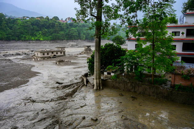 August 26, 2026, Kathmandu, Bagmati, Nepal: NUWAKOT, NEPAL - AUGUST 26: An aftermath view of flash floods and mudslides along the Trishuli River in Nuwakot, Nepal, on August 26, 2026. A catastrophic flash flood swept through Nepalâ€⠢s northern border region after an ice-and-rock avalanche, reportedly triggered by an earthquake, caused a sudden surge in the Lhende River on the Nepal-China border and sent massive volumes of water, mud and debris downstream into the Bhote Koshi and Trishuli river systems. The disaster devastated settlements in Rasuwa and Nuwakot districts, sweeping away homes, roads, bridges, vehicles and other infrastructure and severely damaging hydropower and power facilities. In Nuwakot, riverside settlements includin - ZUMAs330 20260826_zsp_s330_042 Copyright: xSafalxPrakashxShresthax