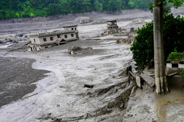 August 26, 2026, Kathmandu, Bagmati, Nepal: NUWAKOT, NEPAL - AUGUST 26: An aftermath view of flash floods and mudslides along the Trishuli River in Nuwakot, Nepal, on August 26, 2026. A catastrophic flash flood swept through Nepalâ€⠢s northern border region after an ice-and-rock avalanche, reportedly triggered by an earthquake, caused a sudden surge in the Lhende River on the Nepal-China border and sent massive volumes of water, mud and debris downstream into the Bhote Koshi and Trishuli river systems. The disaster devastated settlements in Rasuwa and Nuwakot districts, sweeping away homes, roads, bridges, vehicles and other infrastructure and severely damaging hydropower and power facilities. In Nuwakot, riverside settlements includin - ZUMAs330 20260826_zsp_s330_045 Copyright: xSafalxPrakashxShresthax
