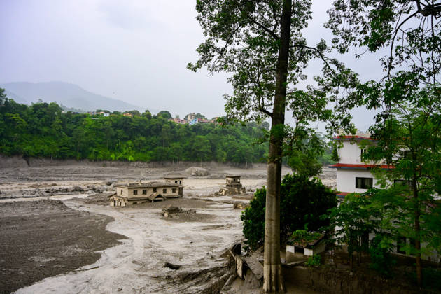 August 26, 2026, Kathmandu, Bagmati, Nepal: NUWAKOT, NEPAL - AUGUST 26: An aftermath view of flash floods and mudslides along the Trishuli River in Nuwakot, Nepal, on August 26, 2026. A catastrophic flash flood swept through Nepalâ€⠢s northern border region after an ice-and-rock avalanche, reportedly triggered by an earthquake, caused a sudden surge in the Lhende River on the Nepal-China border and sent massive volumes of water, mud and debris downstream into the Bhote Koshi and Trishuli river systems. The disaster devastated settlements in Rasuwa and Nuwakot districts, sweeping away homes, roads, bridges, vehicles and other infrastructure and severely damaging hydropower and power facilities. In Nuwakot, riverside settlements includin - ZUMAs330 20260826_zsp_s330_048 Copyright: xSafalxPrakashxShresthax