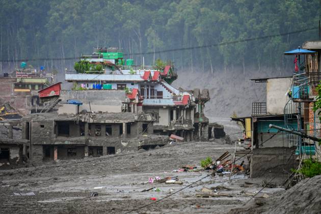 August 26, 2026, Nuwakot, Bagmati, Nepal: NUWAKOT, NEPAL - AUGUST 26, 2026: An aftermath view of flash floods and mudslides along the Trishuli River. A catastrophic flash flood swept through Nepalâ€⠢s northern border region after an ice-and-rock avalanche, reportedly triggered by an earthquake, caused a sudden surge in the Lhende River on the Nepal-China border and sent massive volumes of water, mud and debris downstream into the Bhote Koshi and Trishuli river systems. The disaster devastated settlements in Rasuwa and Nuwakot districts, sweeping away homes, roads, bridges, vehicles and other infrastructure and severely damaging hydropower and power facilities. In Nuwakot, riverside settlements including Trishuli Bazaar, Devighat, Betr - ZUMAq101 20260826_zna_q101_060 Copyright: xSafalxPrakashxShresthax