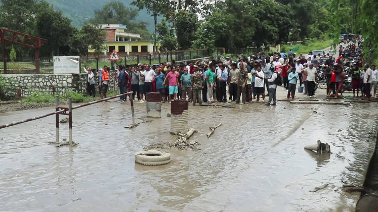 RECORD DATE NOT STATED Flash flood ravages Nepal™s Rasuwa Rasuwa Nepal , Aug 26 (ANI): People stand near an area damaged by mud-laden floodwaters following a flash flood caused by an outburst in the Bhotekoshi River, in Rasuwa on Wednesday. Around 105 Indians among the foreign nationals reported missing after the flash flood. (RSS Nepal ANI Video Grab) Rasuwa Nepal Copyright: xANIx ANI_20260826307