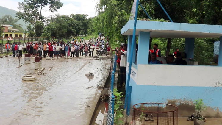 RECORD DATE NOT STATED Flash flood ravages Nepal™s Rasuwa Rasuwa Nepal , Aug 26 (ANI): People stand near an area damaged by mud-laden floodwaters following a flash flood caused by an outburst in the Bhotekoshi River, in Rasuwa on Wednesday. Around 105 Indians among the foreign nationals reported missing after the flash flood. (RSS Nepal ANI Video Grab) Rasuwa Nepal Copyright: xANIx ANI_20260826308