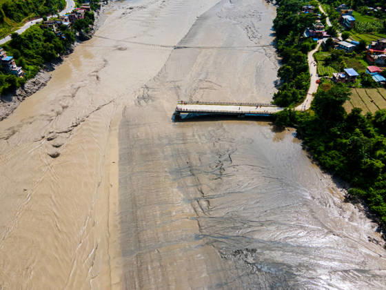 Aerial View Shows Extensive Damage After Flash Flood Sweeps Through The Bhotekoshi River In Nuwakot Aerial view shows flood-damaged areas after a flash flood swept through the Bhotekoshi River in Nuwakot, Nepal, on August 26, 2026. The flooding caused widespread damage to homes, roads, bridges and other infrastructure in the area, while many people remain missing; the figures are still developing Nuwakot bagmati Nepal  Copyright: xAmbirxTolangx originalFilename: tolang-aerialvi260826_np3hE.jpg