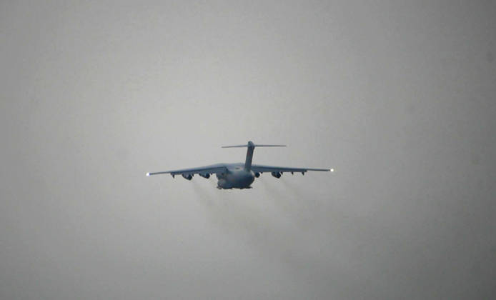 (260827) -- CHENGDU, Aug. 27, 2026 -- A Y-20 transport aircraft of the western theater command takes off at an airport in southwest China on Aug. 27, 2026. A directing group from the Western Theater Command of the Chinese People s Liberation Army (PLA) has been dispatched to the Xizang Autonomous Region in southwest China on Thursday morning to coordinate joint rescue operations by military personnel in mudslide-hit Gyirong County. Carried by the Y-20 transport aircraft of the western theater command, the group will organize military forces to assist in disaster relief efforts. (Photo by Xinhua) (SpotNews) CHINA-XIZANG-MUDSLIDE-RESCUE FORCES (CN) SongxZhengsheng 