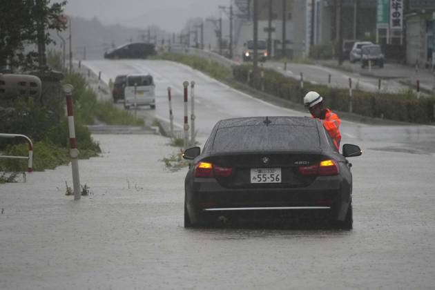 Aftermath of torrential rain in central Japan Photo shows an abandoned vehicle on an inundated road in Himi, Toyama Prefecture, on Aug. 27, 2026, following torrential rain.  A14AA0005626662P