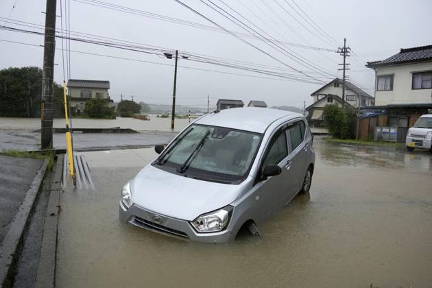 Aftermath of torrential rain in central Japan Photo shows an abandoned vehicle in floodwater in Himi, Toyama Prefecture, on Aug. 27, 2026, following torrential rain.  A14AA0005626665P