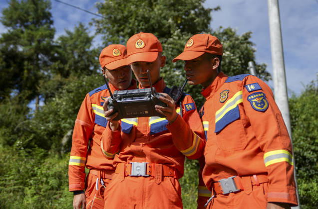 (260827) -- XIGAZE, Aug. 27, 2026 -- Rescuers inspect the mudslide-hit areas with a drone, in Xigaze, southwest China s Xizang Autonomous Region, Aug. 27, 2026. A mudslide, which occurred on the Nepalese side, struck Gyirong Port in Gyirong County of Xigaze City, Xizang, on Wednesday morning, leaving three people dead and 558 others, including 260 foreign nationals, missing, according to preliminary estimates. ) (SpotNews) CHINA-XIZANG-XIGAZE-MUDSLIDE-RESCUE (CN) JigmexDorje