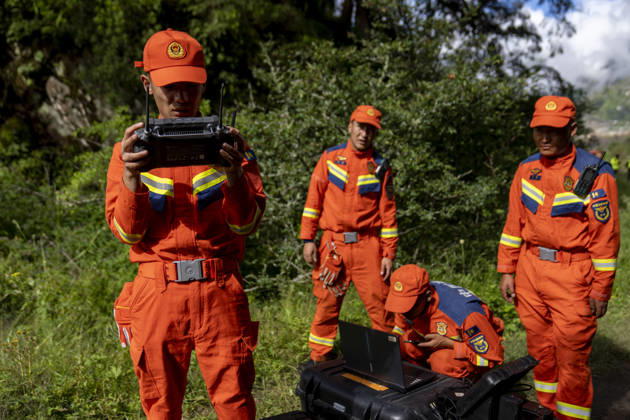 (260827) -- XIGAZE, Aug. 27, 2026 -- Rescuers inspect the mudslide-hit areas with a drone, in Xigaze, southwest China s Xizang Autonomous Region, Aug. 27, 2026. A mudslide, which occurred on the Nepalese side, struck Gyirong Port in Gyirong County of Xigaze City, Xizang, on Wednesday morning, leaving three people dead and 558 others, including 260 foreign nationals, missing, according to preliminary estimates. ) (SpotNews) CHINA-XIZANG-XIGAZE-MUDSLIDE-RESCUE (CN) JigmexDorje