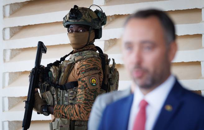 Burkina Faso s solder pictured near Belgian Foreign Minister Maxime Prevot after a meeting with Burkina Faso President Ibrahim Traore on the second day of a diplomatic mission of Belgian Foreign Minister in the Sahel region, in Ouagadougou, Burkina Faso.  BENOITxDOPPAGNE 184473329