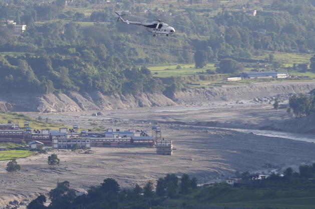 August 28, 2026, Nuwakot, Nepal: A rescue helicopter takes flight following flash floods at Devighat in Bidur Municipality, Nuwakot district, Nepal, on Thursday, August 27, 2026. The floods, triggered by a glacial collapse and debris flow upstream, have killed at least 270 people and left 826 others out of contact, according to Nepalese authorities, with search and rescue operations continuing. Nuwakot Nepal - ZUMAg200 20260828_zap_g200_001 Copyright: xSkandaxGautamx