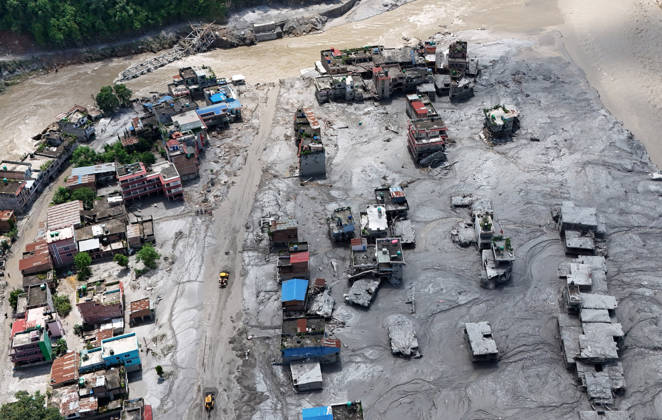 August 27, 2026, Nuwakot, Nepal: Bulldozers try to rebuild the roads after buildings and roads are buried in mud and debris following flash floods at Devighat in Bidur Municipality, Nuwakot district, Nepal, on Thursday, August 27, 2026. The floods, triggered by a glacial collapse and debris flow upstream, have killed at least 270 people and left 826 others out of contact, according to Nepalese authorities, with search and rescue operations continuing. Nuwakot Nepal - ZUMAg200 20260827_zap_g200_002 Copyright: xSkandaxGautamx