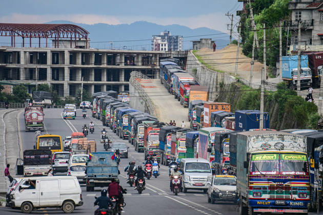 August 27, 2026, Kathmandu, Bagmati, Nepal: Trucks and other vehicles remain stranded along the Kalankiâ€Thankotâ€Nagdhunga route in Kathmandu, Nepal, on August 27, 2026, as major highways remain closed following devastating flash floods and landslides. The stranded vehicles have occupied multiple lanes along the road, causing traffic congestion and further disrupting movement in the area. The floods swept through Rasuwa and other parts of central Nepal before surging downstream along the Trishuli and Narayani river systems, damaging roads, bridges, settlements and other infrastructure. The Nagdhungaâ€Muglin route, a key road connection between Kathmandu and other parts of the country, has been closed, disrupting the movem - ZUMAs330 20260827_zsp_s330_018 Copyright: xSafalxPrakashxShresthax