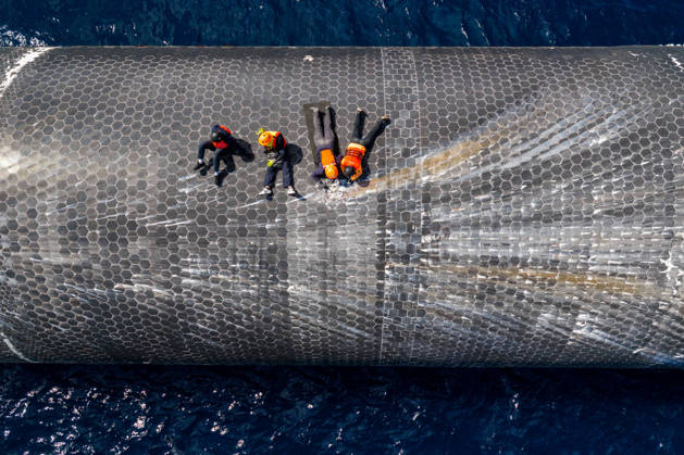 SpaceX engineers spent several days inspecting Ship 40 in the waters off Christmas Island as seen in pictures released on Thursday, August 27, 2026. They collected heatshield samples and gained vital insight into how the vehicle handled reentry, with improvements now planned for future vehicles. Starship has now been loaded onto a semi-submersible ship to begin the several-month journey back to Starbase.  WAX2026082702 SPACEX