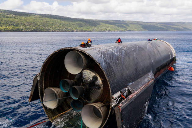 SpaceX engineers spent several days inspecting Ship 40 in the waters off Christmas Island as seen in pictures released on Thursday, August 27, 2026. They collected heatshield samples and gained vital insight into how the vehicle handled reentry, with improvements now planned for future vehicles. Starship has now been loaded onto a semi-submersible ship to begin the several-month journey back to Starbase.  WAX2026082703 SPACEX