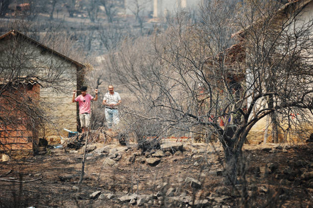 Wildfires in Algeria claim at least 12 lives across several provinces JIJEL, ALGERIA - AUGUST 27: Forest fires in eastern Algerian provinces turn green vegetation to ashes and cause material damage to homes and vehicles in the Beni Aicha village of Boraoui Belhadef Municipality in Jijel, Algeria on August 27, 2026. At least 12 people have died in wildfires that have swept through several provinces in Algeria, Interior Minister Said Sayoud said Wednesday, according to local media. The 159 fire outbreaks reported across the country have claimed five lives in Jijel, four in Bejaia and three in Tizi Ouzou. Hamza Zait Anadolu Jijel Algeria. Editorial use only. Please get in touch for any other usage.  Copyright: x2026xAnadoluxHamzaxZaitx