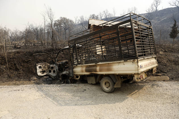 Fires in Jijel and Bedjaia: A general view of the burned houses, cars, and animals in the village of Nador, in the Jijel Mountains east of Algiers, in Algeria on August 27, 2026. The Algerian Ministry of the Interior announced that at least 12 people have died and 54 others have been injured in multiple forest fires across the country. Photo by Billel Bensalem, APP, Jijel, Algeria Copyright: xAlgÃ riexPressexPhotosxBillelxBensalemx xAPPx _MG_8980