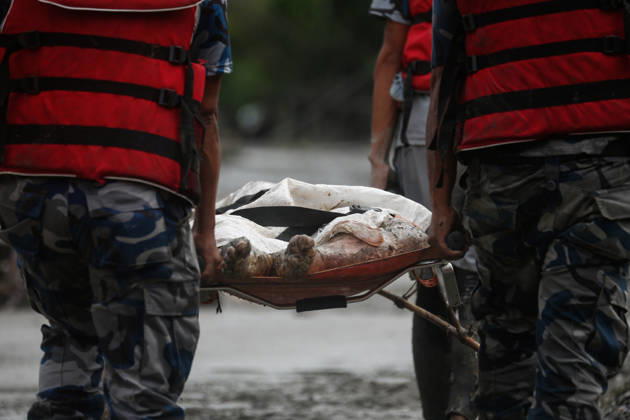 Nepal Disaster: The Second Day Of Devastation, Rescue And Recovery (EDITORS NOTE: Image depicts death.) Security personnel collect the bodies of flood victims in Nuwakot, Nepal, on August 27, 2026, following an outburst of a glacial lake in Tibet. Rescue and recovery operations continue in the flood-affected area as authorities search for victims and assess the extent of the damage. Nuwakot Nepal  Copyright: xSanjitxPariyarx originalFilename: pariyar-notitle260827_nplYD.jpg
