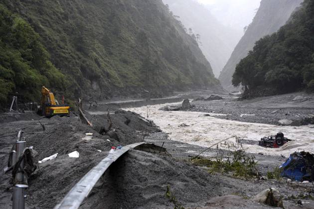 SHIGATSE, CHINA - AUGUST 28: Excavators and loaders clear debris to restore traffic on a road section affected by a landslide on August 28, 2026 in Shigatse, Xizang Autonomous Region of China. Rescue efforts are underway after a mudslide struck near Gyirong Port in Gyirong County, Xigaze City, southwest China s Xizang Autonomous Region. Multiple rescue teams have been deployed to the affected area to search for missing people, clear roads and assess potential risks. Emergency supplies and rescue equipment have also been mobilized.  Copyright: xChinaxNewsxServicex 111662579485