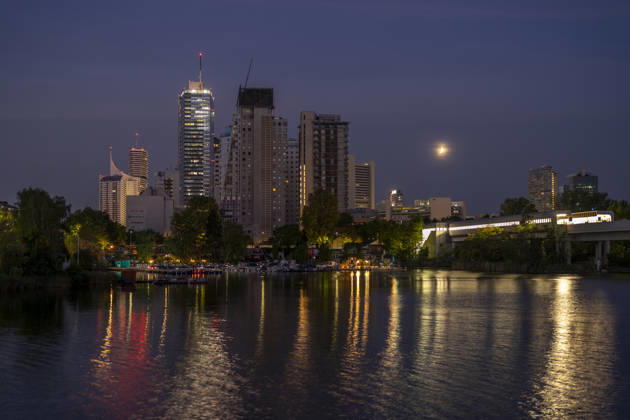 Moon during partial eclipse seen from Austria™s capital Vienna, in frame is Austria™s highest building, the DC Tower as well as the Vienna International Centre, also known as UNO City, housing the United Nations. Vienna Vienna Austria