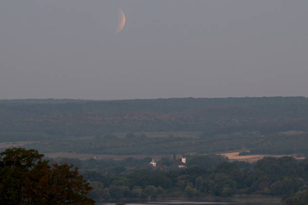 Partial lunar eclipse observed from Northern Hungary ZSUJTA, HUNGARY - AUGUST 28: A partial lunar eclipse, caused by the Moon passing through Earth s shadow, is observed above a tiny village of Zsujta, Hungary, on August 28, 2026. Robert Nemeti Anadolu Zsujta Hungary. Editorial use only. Please get in touch for any other usage. Copyright: x2026xAnadoluxRobertxNemetix